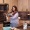 Woman holding a book in a kitchen