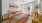 a bedroom with a bed and a fan