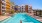 a pool with a building in the background