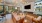 a lounge room with a tv and seating